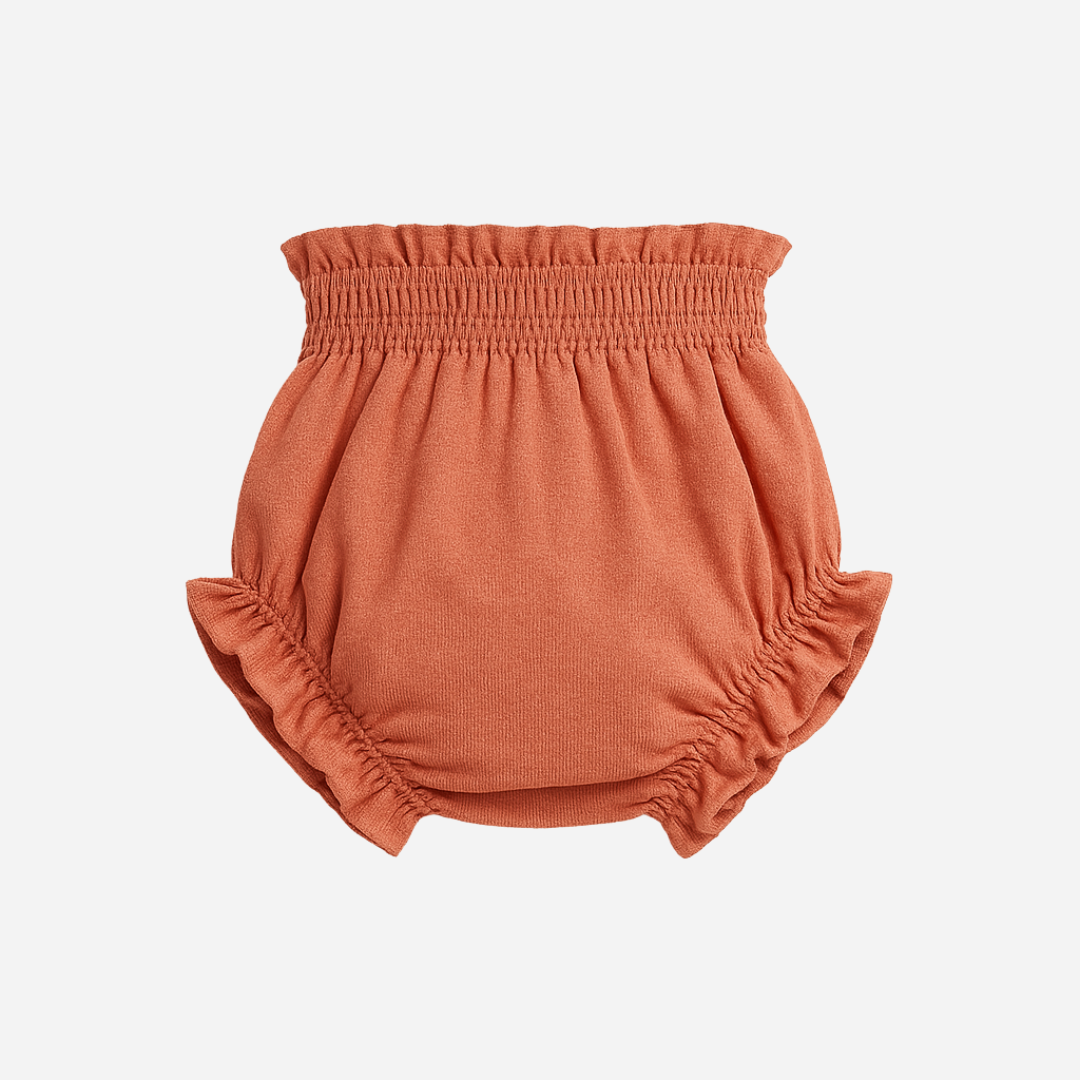 sold at Bombon shop, designed by Paloma de la O brand, this coral bow bloomer for baby girls is ideal for spring summer. back view