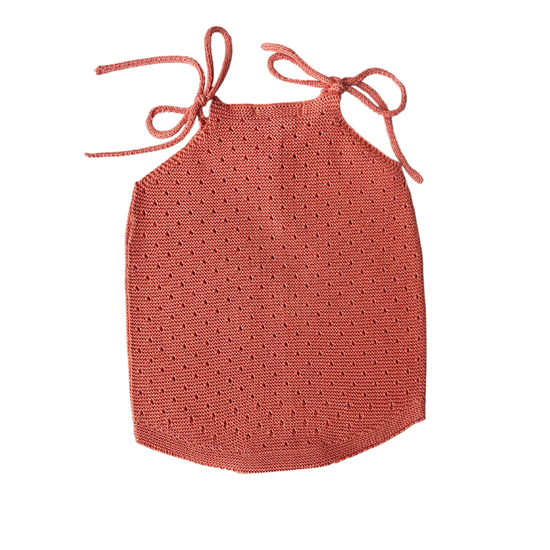 Sold at Bombon shop, designed by Paloma de la O brand, this coral romper for baby girls is ideal for spring and summer. back view