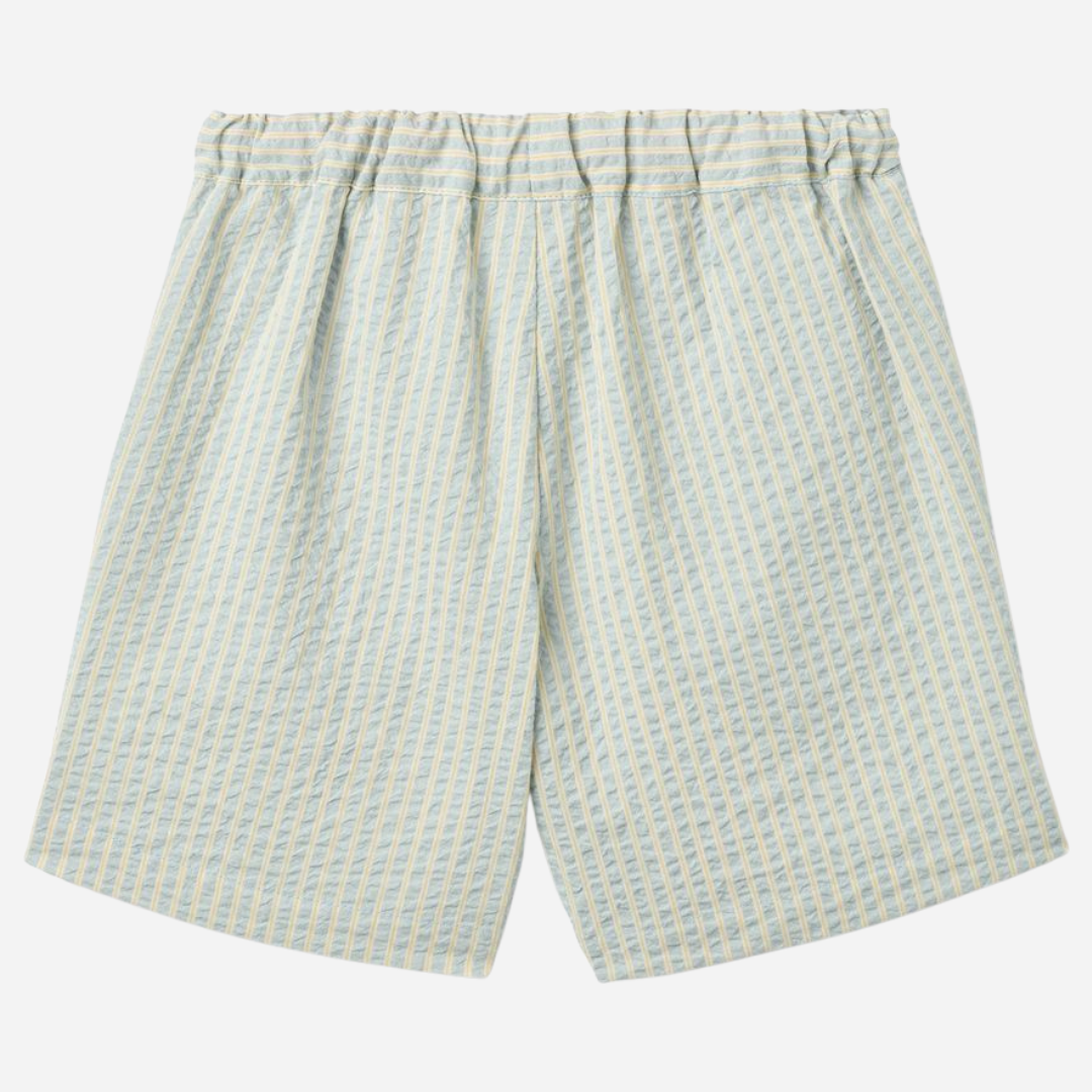 Sold at Bombon Shop, designed by Wheat, summer sky stripe organic cotton kids shorts with elastic waistband and soft blue vertical stripes.