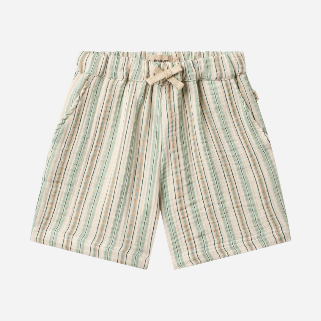 Sold at Bombon Shop, designed by Wheat, summer stripe organic cotton kids shorts with vertical striped pattern and elastic waistband.