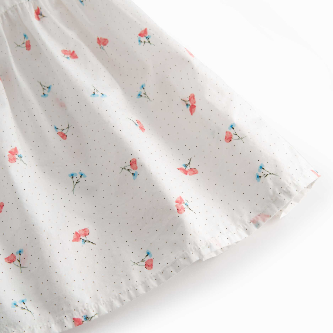 Sold at Bombon shop, designed by Mar Mar Copenhagen, Dalani children’s dress in Poppy print with ruffled straps