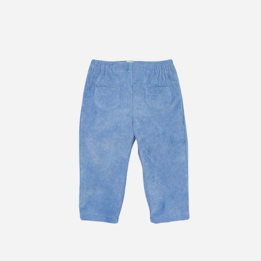 Sold at Bombon shop, designed by Fina Ejerique, blue corduroy baby trousers with elastic waistband and back pockets. front