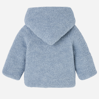 Sold at Bombon shop, designed by Paz Rodriguez, baby blue hooded coat with textured knit and white lining.
