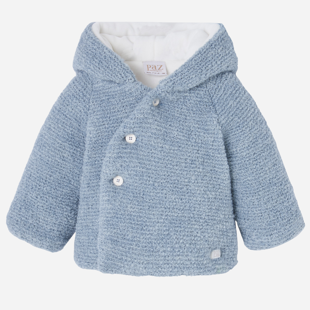 Sold at Bombon shop, designed by Paz Rodriguez, baby blue hooded coat with textured knit and white lining.