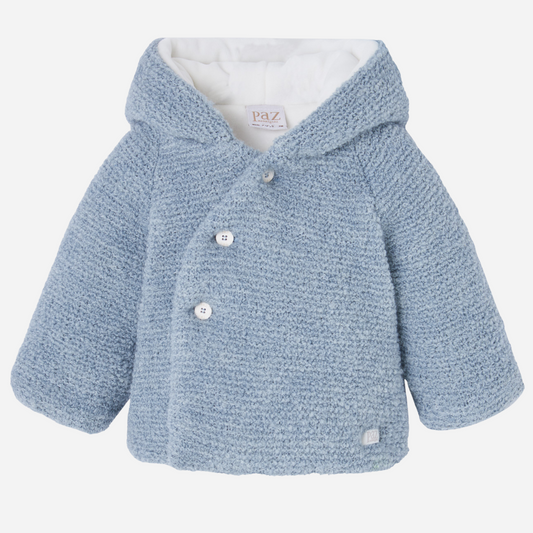 Sold at Bombon shop, designed by Paz Rodriguez, baby blue hooded coat with textured knit and white lining.
