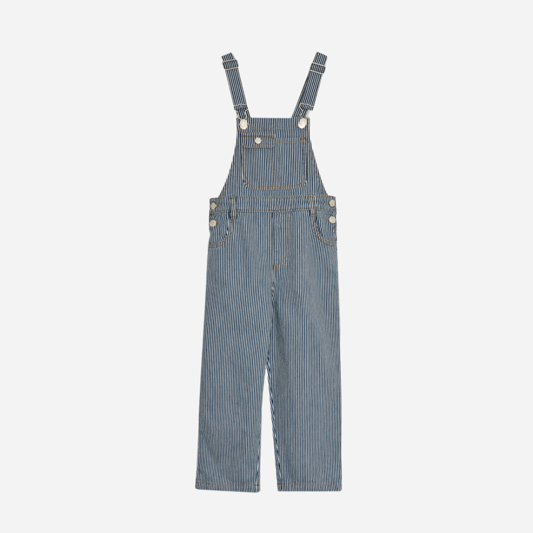 Sold at Bombon Shop, these unisex overalls by The New Society are made from a striped denim with a vintage wash, featuring adjustable shoulder straps, side button closures, and patch pockets for a timeless, relaxed silhouette. front