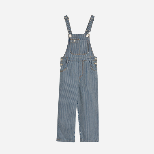 Sold at Bombon Shop, these unisex overalls by The New Society are made from a striped denim with a vintage wash, featuring adjustable shoulder straps, side button closures, and patch pockets for a timeless, relaxed silhouette. front