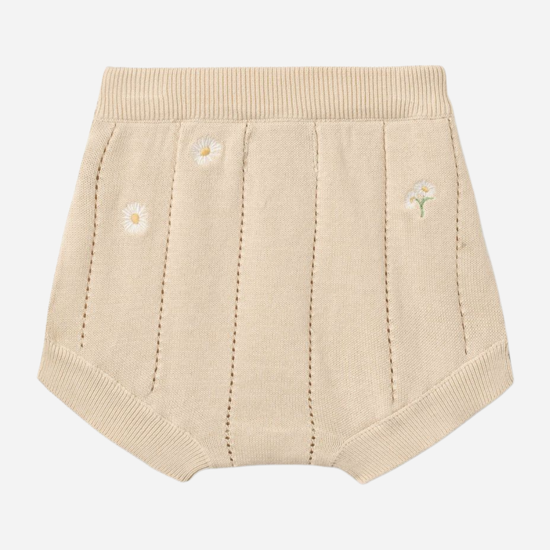 Sold at Bombon Shop, designed by Wheat, sandshell white flowers organic cotton knitted baby shorts with elastic waistband and subtle floral knit details.