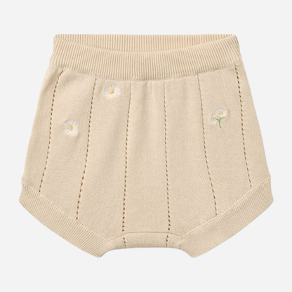 Sold at Bombon Shop, designed by Wheat, sandshell white flowers organic cotton knitted baby shorts with elastic waistband and subtle floral knit details.