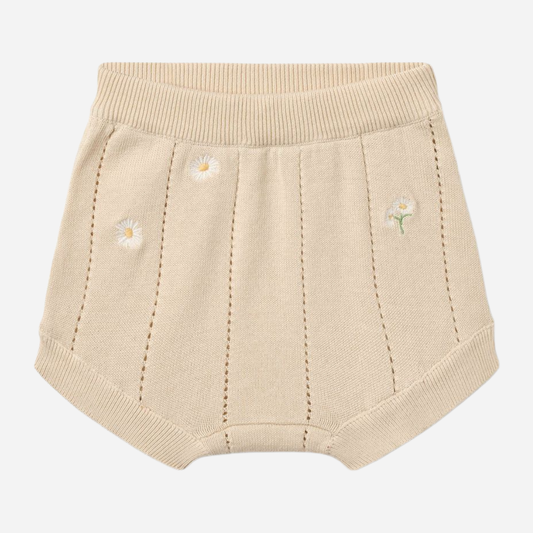 Sold at Bombon Shop, designed by Wheat, sandshell white flowers organic cotton knitted baby shorts with elastic waistband and subtle floral knit details.
