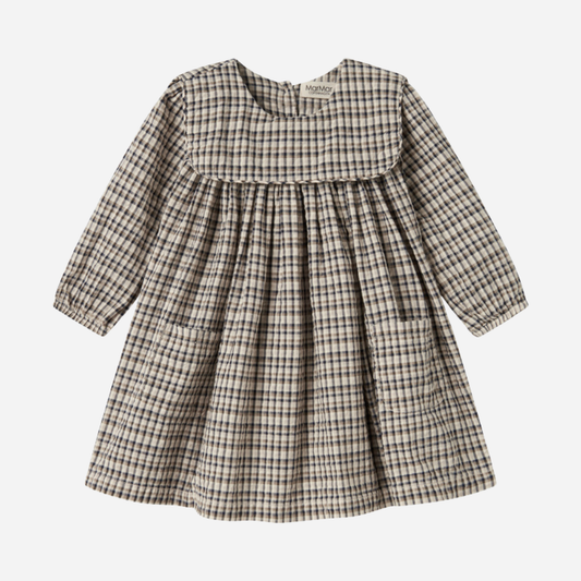 Sold at Bombon shop, designed by MarMar Copenhagen. Beige and navy check long-sleeve cotton dress with gathered yoke and front pockets.