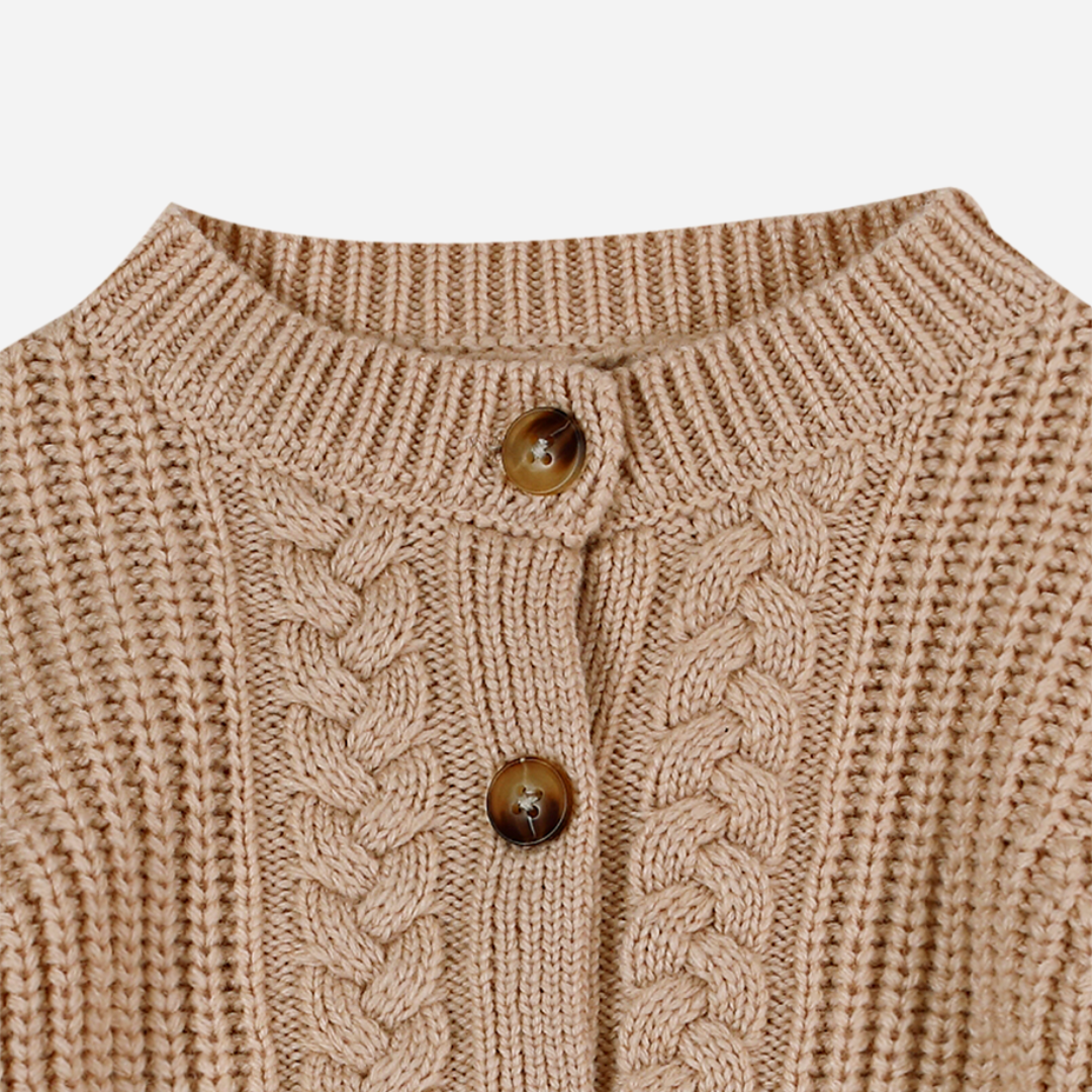 Sold at Bombon shop, designed by Donsje from Amsterdam, this baby and toddler girl cardigan in beige with a braid detail is the perfect pre-fall and transition piece. top view