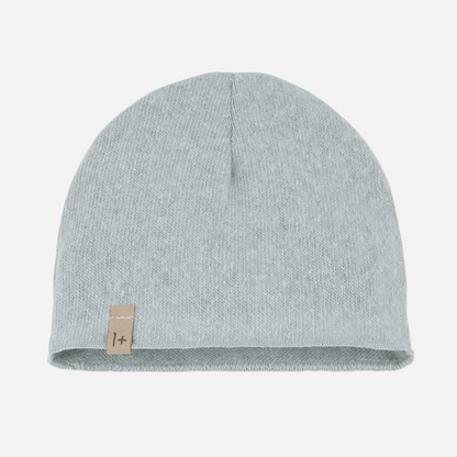The Elise Beanie in Nuvola by 1+ in the family is a cozy winter staple with an airy, cloud-like hue. Crafted in Spain from a soft cotton blend, it offers just the right amount of warmth while maintaining a clean, minimalist look. This versatile beanie effortlessly complements the Nuvola pants or matching pieces from the same collection — perfect for stylish, layered looks all season long. front