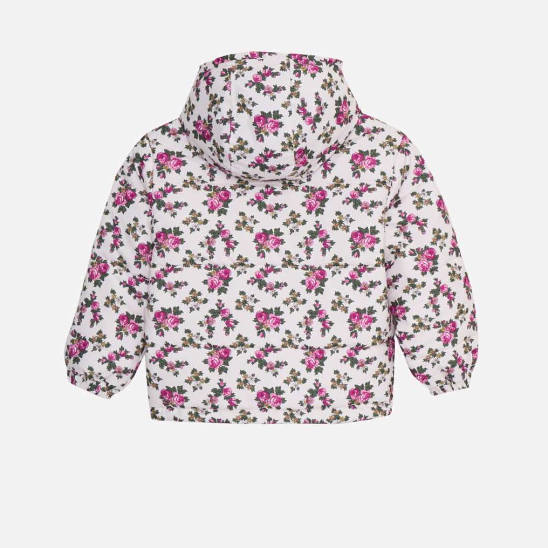 Sold at Bombon shop, this girls’ puffer jacket by The New Society features an all-over rose floral print on a cream base, complete with a hood, front pockets, and snap-button closure—combining warmth, function, and a touch of charm for cooler days. back