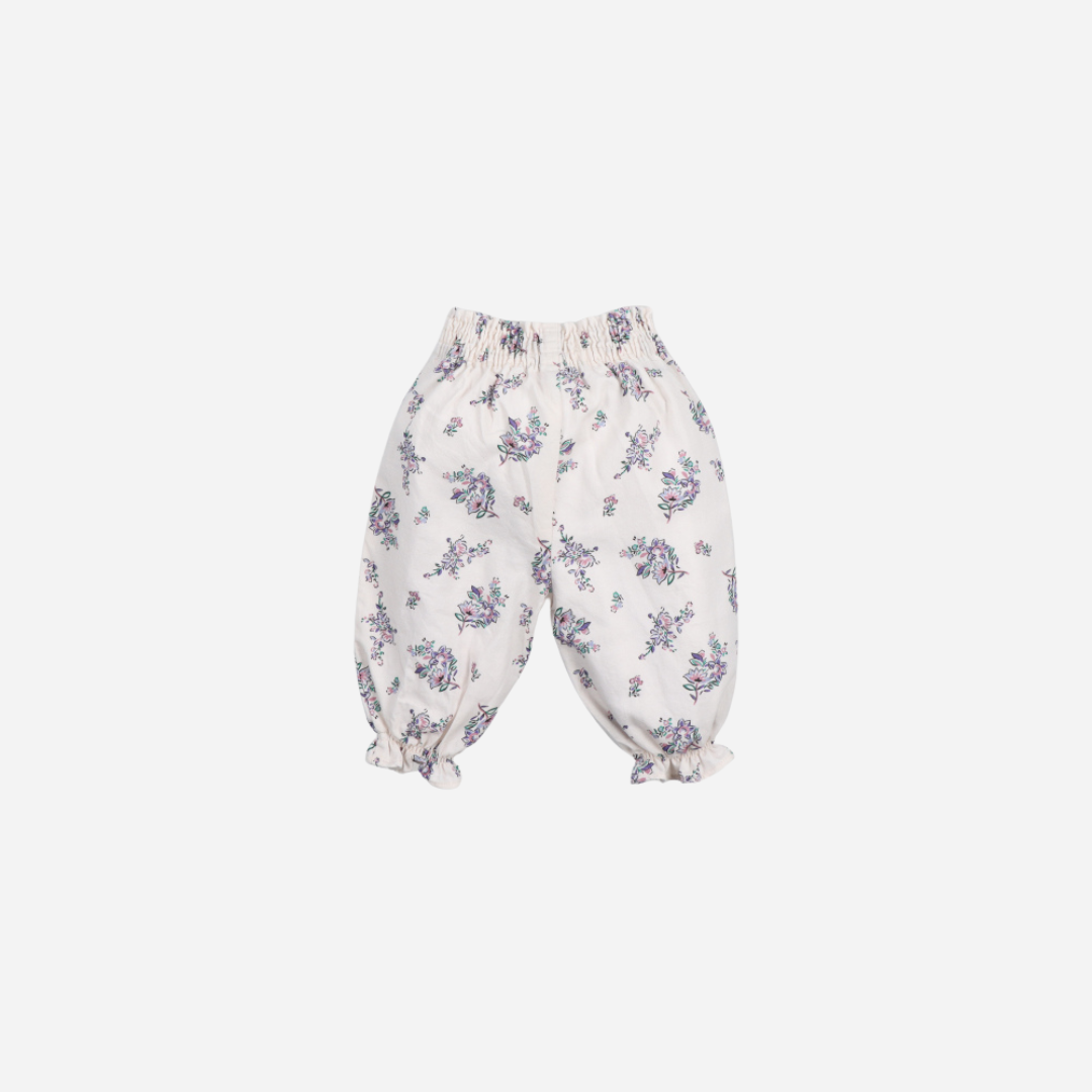 Sold at Bombon shop, these baby girl pants by The New Society feature an all-over floral print, an elastic waistband for easy dressing, and gathered ruffle hems for a comfortable and playful everyday outfit. back