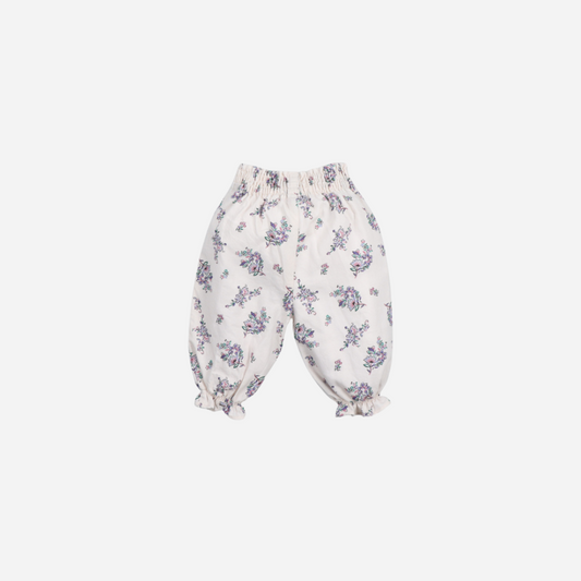 Sold at Bombon shop, these baby girl pants by The New Society feature an all-over floral print, an elastic waistband for easy dressing, and gathered ruffle hems for a comfortable and playful everyday outfit. back