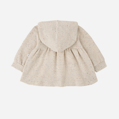 Sold at Bombon shop, designed by 1+ in the family — long-sleeve speckled beige baby dress with gathered waist and hood, shown flat on white background. back