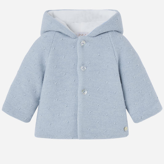 Sold at Bombon shop, designed by Paz Rodriguez, blue knit hooded baby coat with dot texture and button-up front from the Erizos collection.