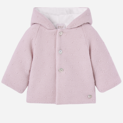 Sold at Bombon shop, designed by Paz Rodriguez, pink knit hooded baby coat with dot texture and button-up front from the Erizos collection.