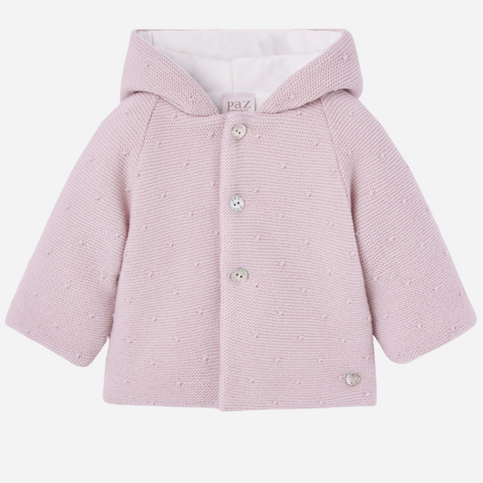 Sold at Bombon shop, designed by Paz Rodriguez, pink knit hooded baby coat with dot texture and button-up front from the Erizos collection.