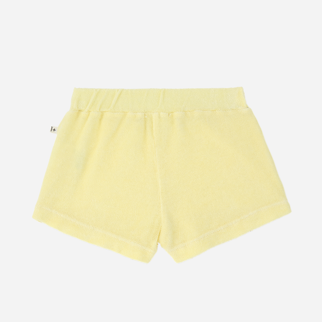 Sold at Bombon Shop, designed by 1+ in the family, lemon baby shorts with elastic waistband and soft cotton fabric.