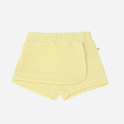 Sold at Bombon Shop, designed by 1+ in the family, lemon baby shorts with elastic waistband and soft cotton fabric.