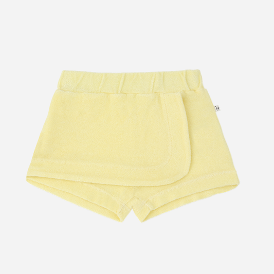 Sold at Bombon Shop, designed by 1+ in the family, lemon baby shorts with elastic waistband and soft cotton fabric.