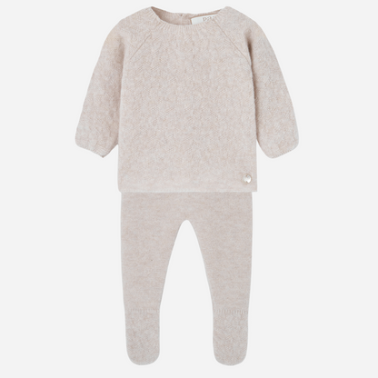 Sold at Bombon shop, designed by Paz Rodriguez. Beige baby knit two-piece set with sweater and footed pants in a soft textured pattern.