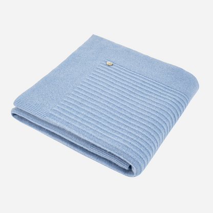 Sold at Bombon shop, designed by Paz Rodriguez. Folded blue baby cashmere blanket with ribbed border detail.