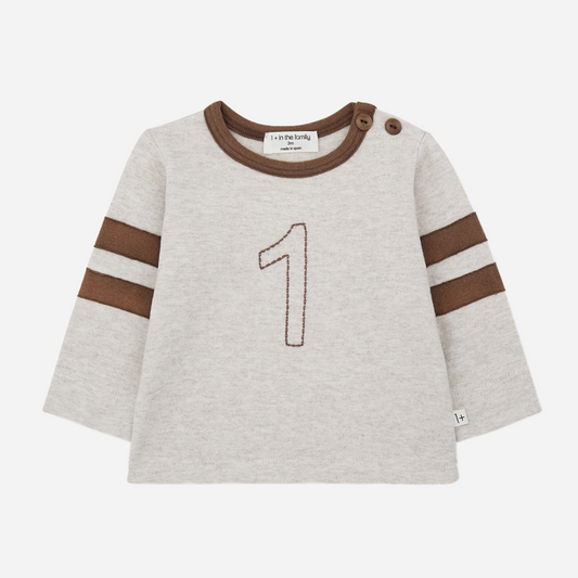 Children's sweater with brown accents and number '1' on a white background