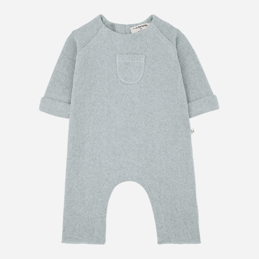 Sold at Bombon shop, designed by 1+ in the family — nuvola blue baby jumpsuit with long sleeves, patch pocket, and rolled cuffs. front