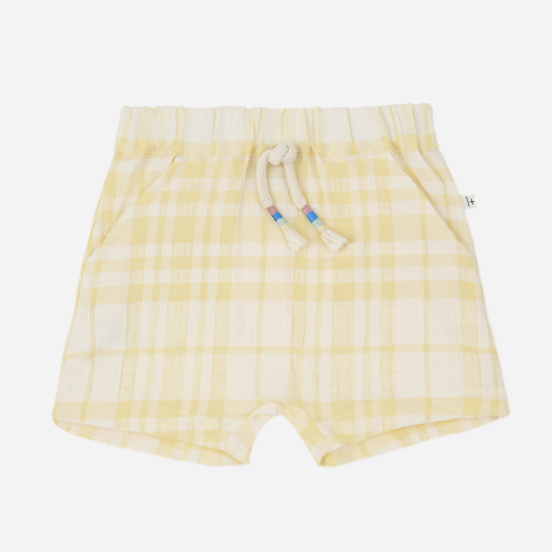 Sold at Bombon Shop, designed by 1+ in the family, lemon check baby bermuda shorts with elastic waistband and soft cotton fabric.