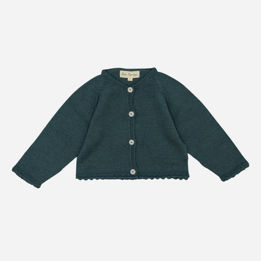 Sold at Bombon shop, designed by Fina Ejerique, a forest-green knit baby cardigan with scalloped trim and front buttons. front