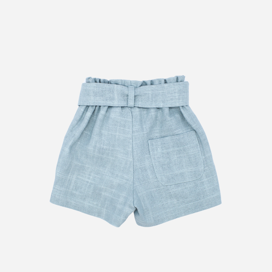 sold at Bombon shop, designed by Fina Ejerique brand, green linen shorts for girls are perfect for spring and summer. Back view