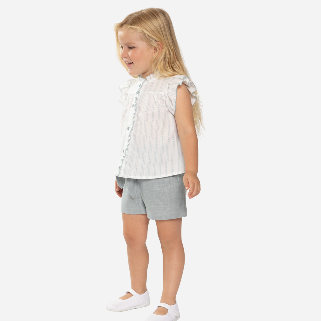 sold at Bombon shop, designed by Fina Ejerique brand, green linen shorts for girls are perfect for spring and summer. model view