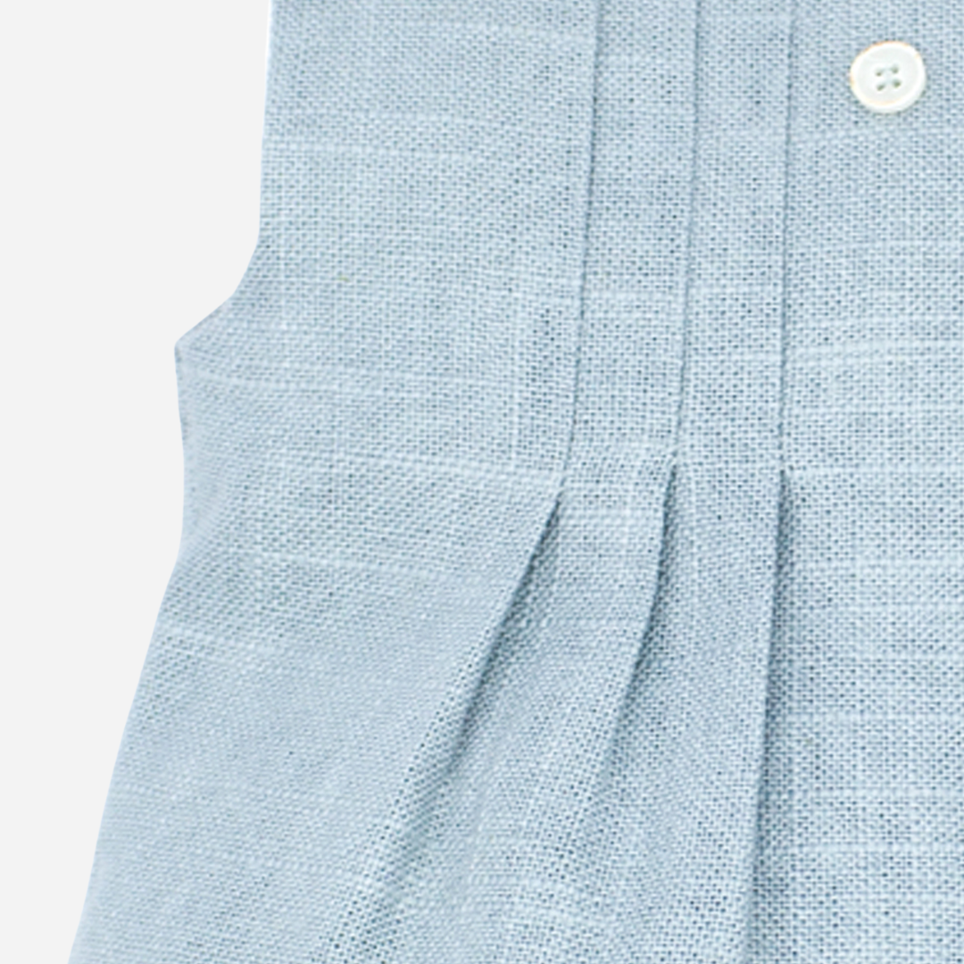 Sold at Bombon shop, designed by Fina Ejerique brand, green linen pleated baby romper perfect for spring and summer. Zoom view
