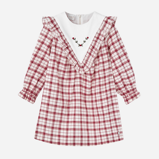 Sold at Bombon shop, designed by Paz Rodriguez, baby and toddler red plaid dress with white embroidered holly collar and ruffle details from the Acebo holiday collection.