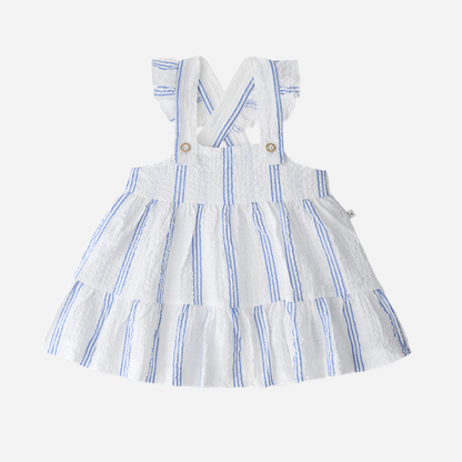 Sold at Bombon Shop, designed by 1+ in the family, ultramarine striped baby dress with adjustable straps and softly gathered skirt.