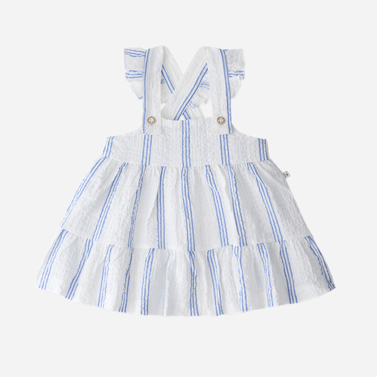 Sold at Bombon Shop, designed by 1+ in the family, ultramarine striped baby dress with adjustable straps and softly gathered skirt.