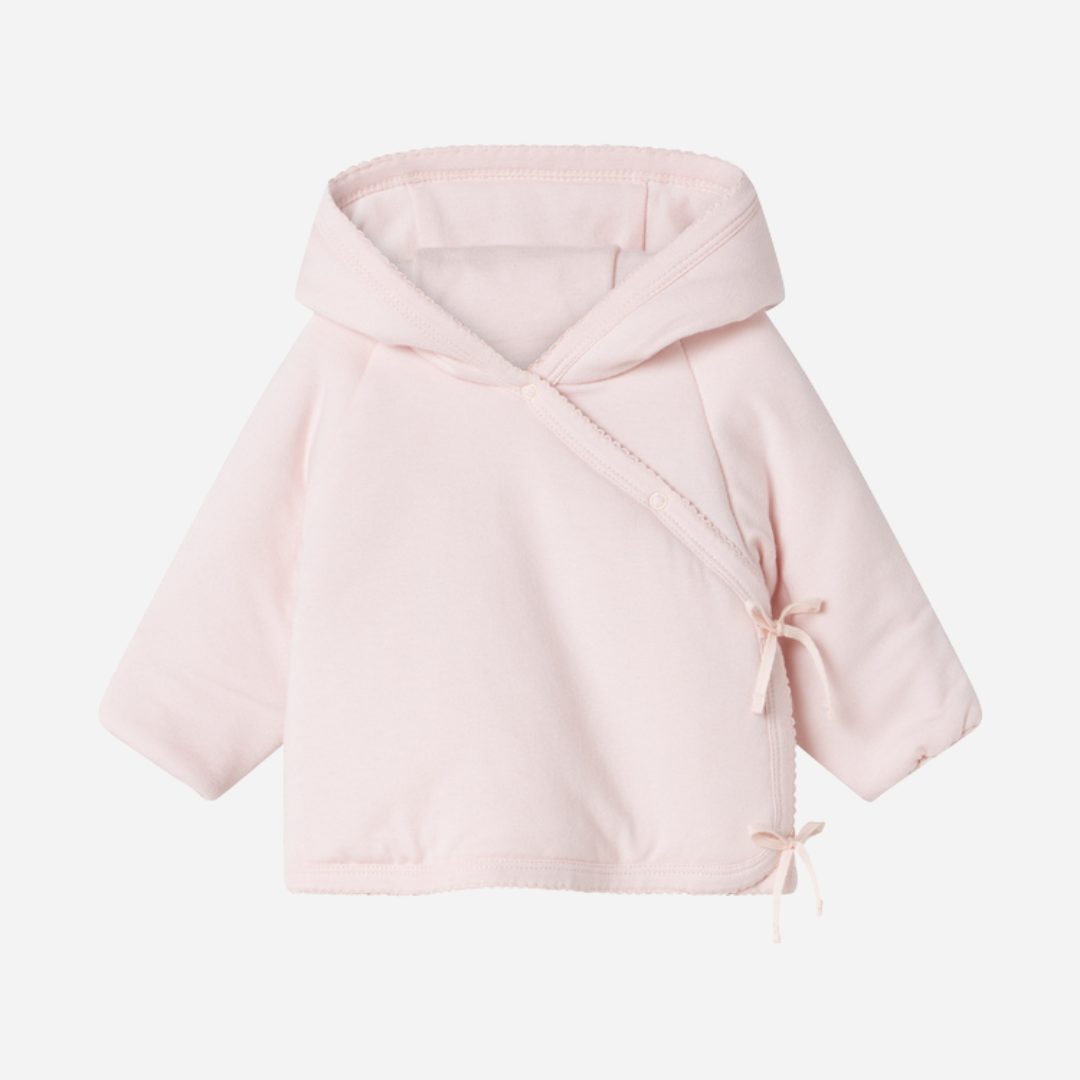 Sold at Bombon shop, designed by MarMar Copenhagen — blush pink organic cotton baby jacket with hood and side tie closure.