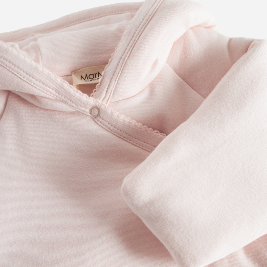 Sold at Bombon shop, designed by MarMar Copenhagen — blush pink organic cotton baby jacket with hood and side tie closure.