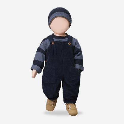 Doll wearing navy blue overalls, striped shirt, and hat on a white background