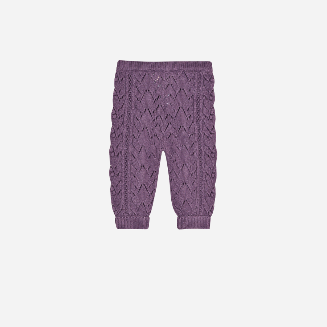 Sold at Bombon shop, these baby girl knit pants by The New Society come in a lilac tone with an all-over pointelle pattern, ribbed cuffs, and a comfortable elastic waistband for a cozy and sweet everyday essential. back