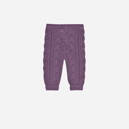 Sold at Bombon shop, these baby girl knit pants by The New Society come in a lilac tone with an all-over pointelle pattern, ribbed cuffs, and a comfortable elastic waistband for a cozy and sweet everyday essential. back