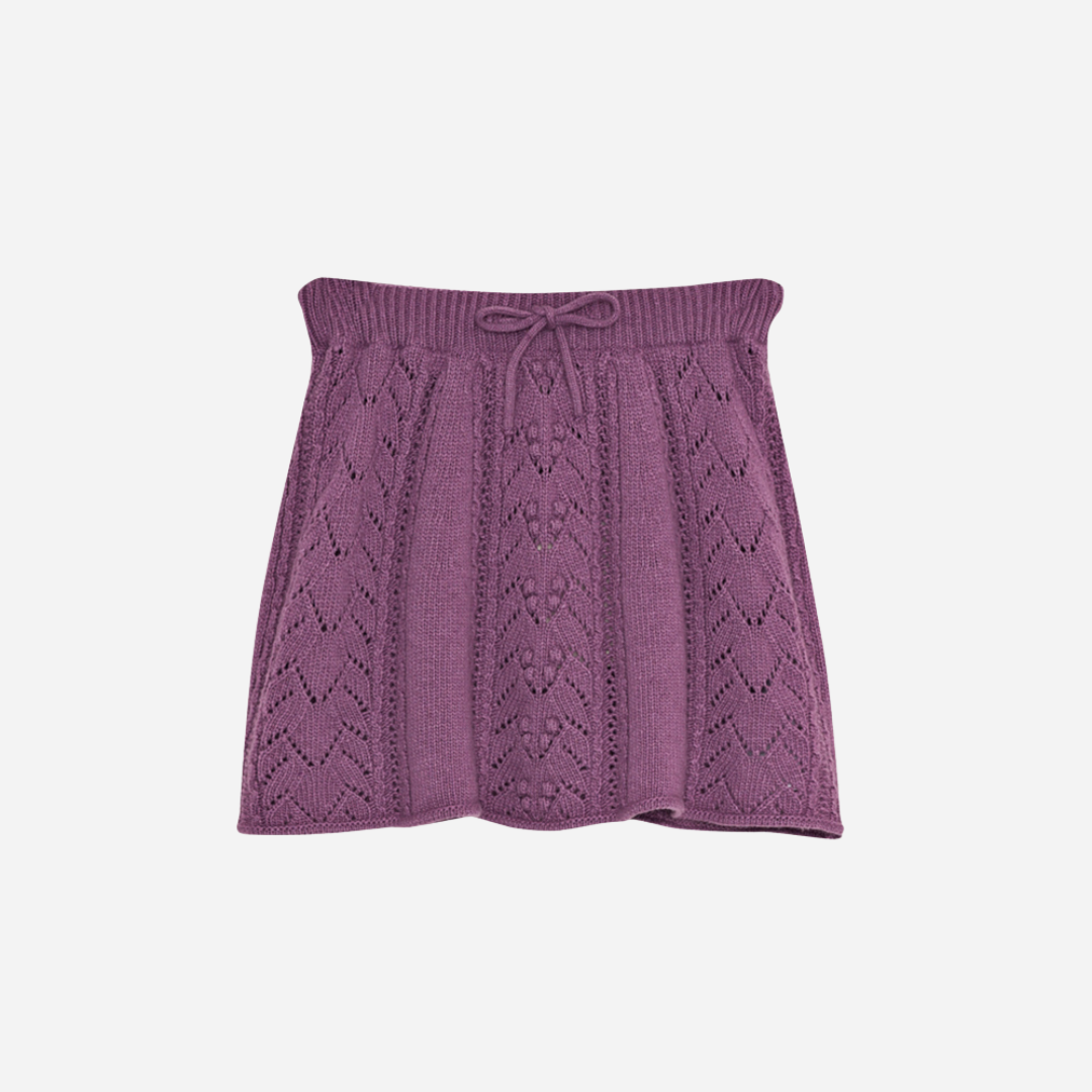 Sold at Bombon shop, this girls’ knit skirt by The New Society comes in a lilac tone with a delicate pointelle design and an adjustable drawstring waistband for a cozy and elegant everyday outfit. front