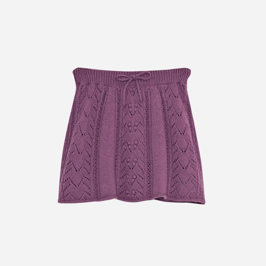 Sold at Bombon shop, this girls’ knit skirt by The New Society comes in a lilac tone with a delicate pointelle design and an adjustable drawstring waistband for a cozy and elegant everyday outfit. front
