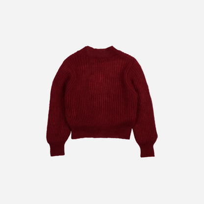 Sold at Bombon shop, this girls’ cardigan by The New Society comes in a rich burgundy knit with ribbed texture, heart-shaped buttons, and a cozy, slightly cropped fit—perfect for layering with a sweet, stylish touch. back