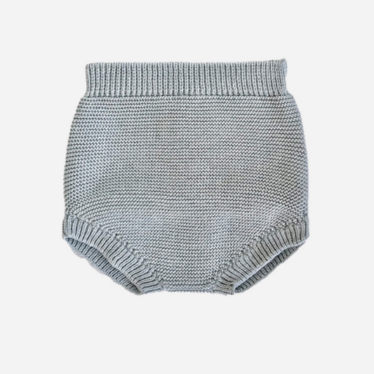 Sold at Bombon shop, designed by Paloma de la O brand, this knitted bloomer in light blue for baby boys is designed to keep them cozy in any occasion