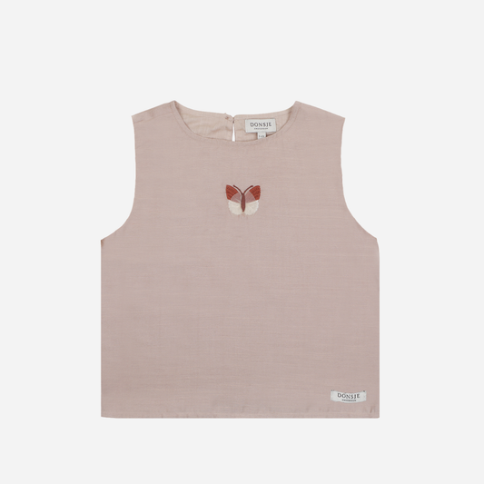 Sold at Bombon shop, designed by Donsje from Amsterdam, this baby and toddler sleeveless top in a soft rose with a butterfly detail for girls is stylish and perfect pre-fall piece. front view