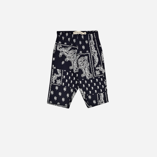 Sold at Bombon shop, these baby and toddler boy pants by The New Society feature a matching navy and white bandana print with an elastic waistband for an easy, comfortable fit—perfect for pairing with the coordinated shirt or mixing with basics. baby version, front